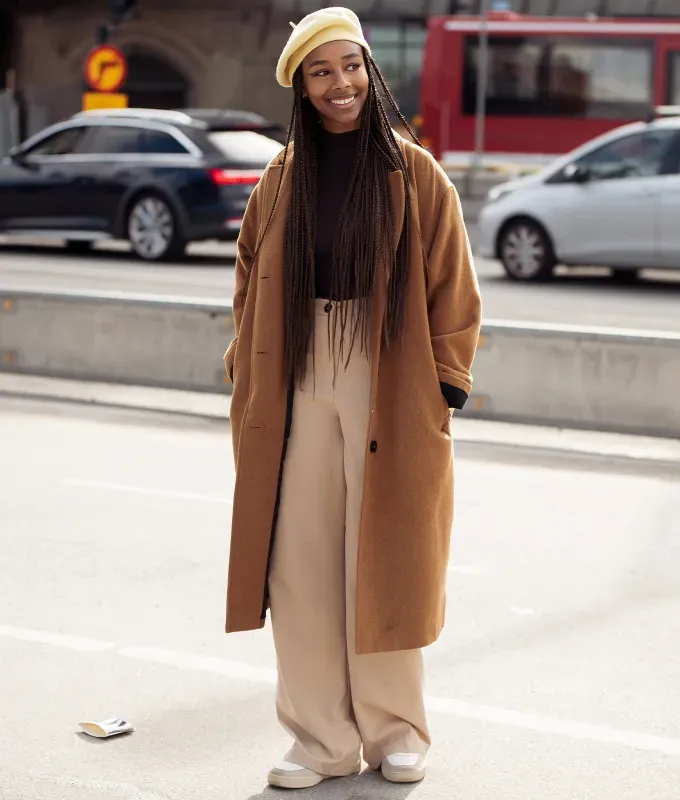 Woman wearing a beige beret over braids' fetchpriority='auto' title='31 Outfit Ideas for a Sparkly Stylish and Rather Festive December