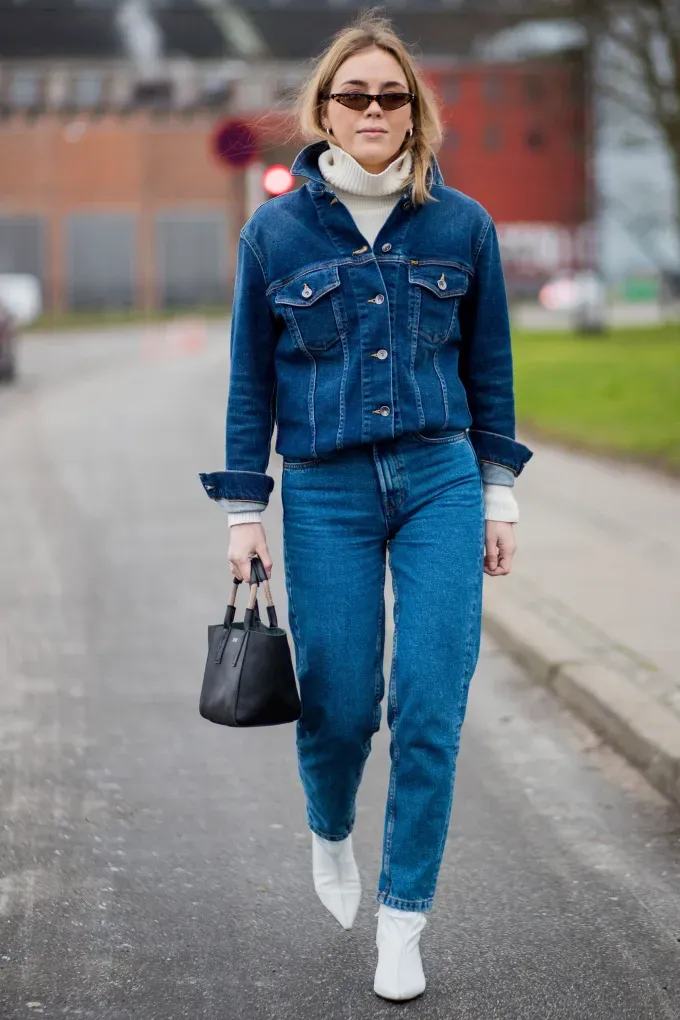 woman weaing white boots and all denim' fetchpriority='auto' title='31 Outfit Ideas for a Sparkly Stylish and Rather Festive December
