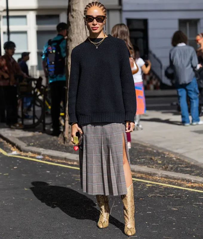 woman wearing a sweater and skirt' fetchpriority='auto' title='31 Outfit Ideas for a Sparkly Stylish and Rather Festive December