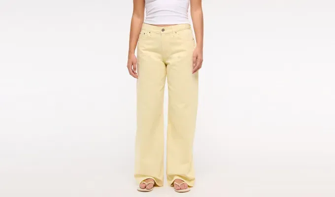 cherry-red-butter-yellow-color-trend: butter yellow low rise jeans' title='Mark My Words: *This* Will Be the Unexpected Color Combo to Wear This Spring