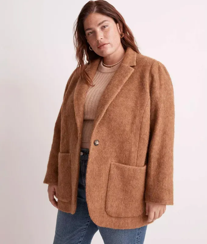 stores like hm madewell. Model wearing blue jeans and a tan and knit fitted sweater with a chestnet wool blazer.' title='16 Stores Like H&M to Shop Right Now