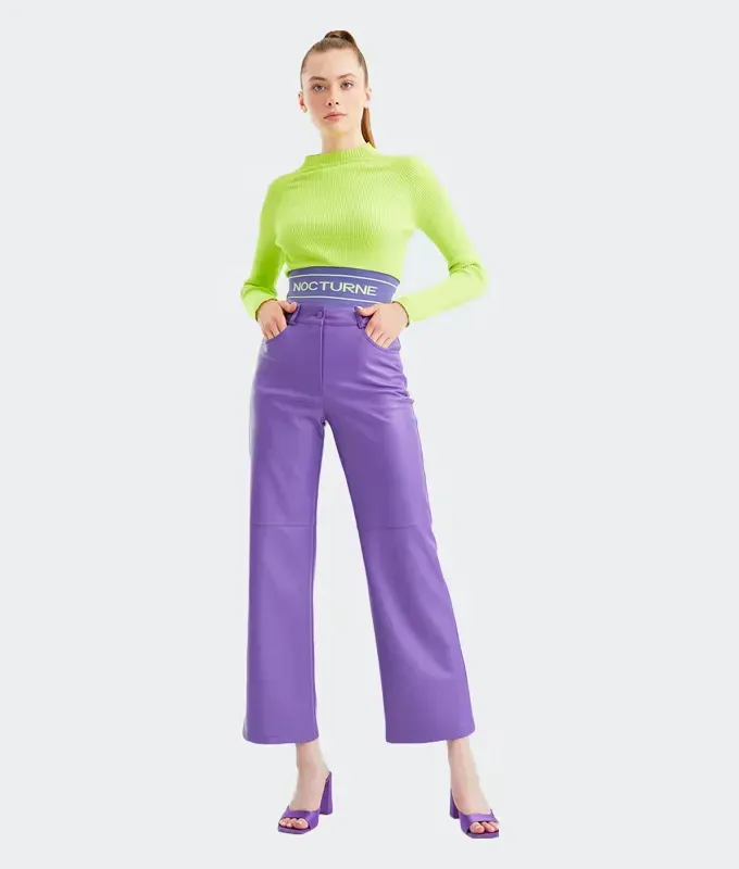 stores like hm verishop. Model wearing a lime green long sleeve top and high-waisted purple pants.' title='16 Stores Like H&M to Shop Right Now