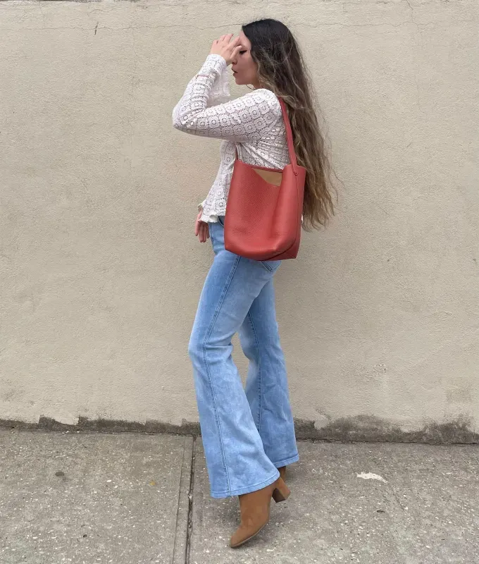How to Wear Flare Jeans as a Petite: Original photo of Stephanie Maida' fetchpriority='auto' title='Flare Jeans Are Trending (Yet Again)—Here’s How to Pull Them Off as a Petite