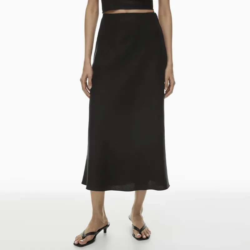 babaton linen skirt 90s fashion trend' title='The ‘90s Fashion Revival Is in Full Swing—Here’s How to Wear the Trend This Summer