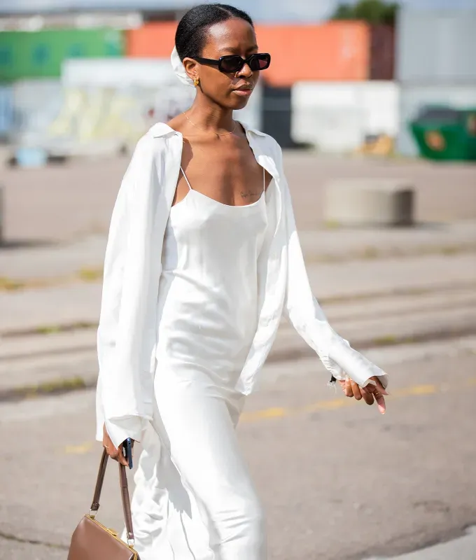 silk slip dress 90s minimalism fashion trend' fetchpriority='auto' title='The ‘90s Fashion Revival Is in Full Swing—Here’s How to Wear the Trend This Summer