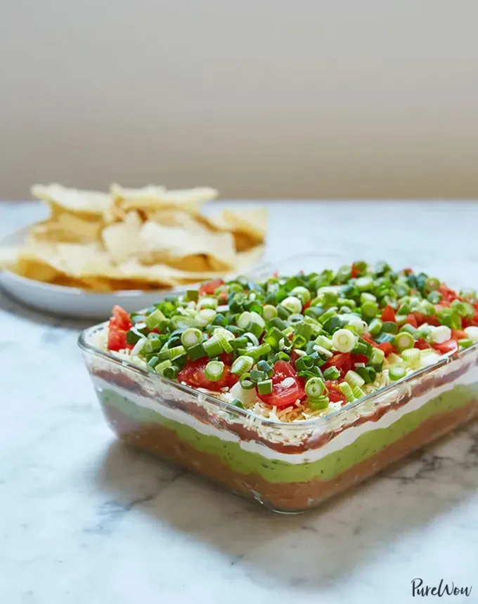 savory appetizers: 7-layer dip' title='51 Savory Appetizers That Are Sure to Get the Party Started from Make-Ahead Gems to Cheesy Delights