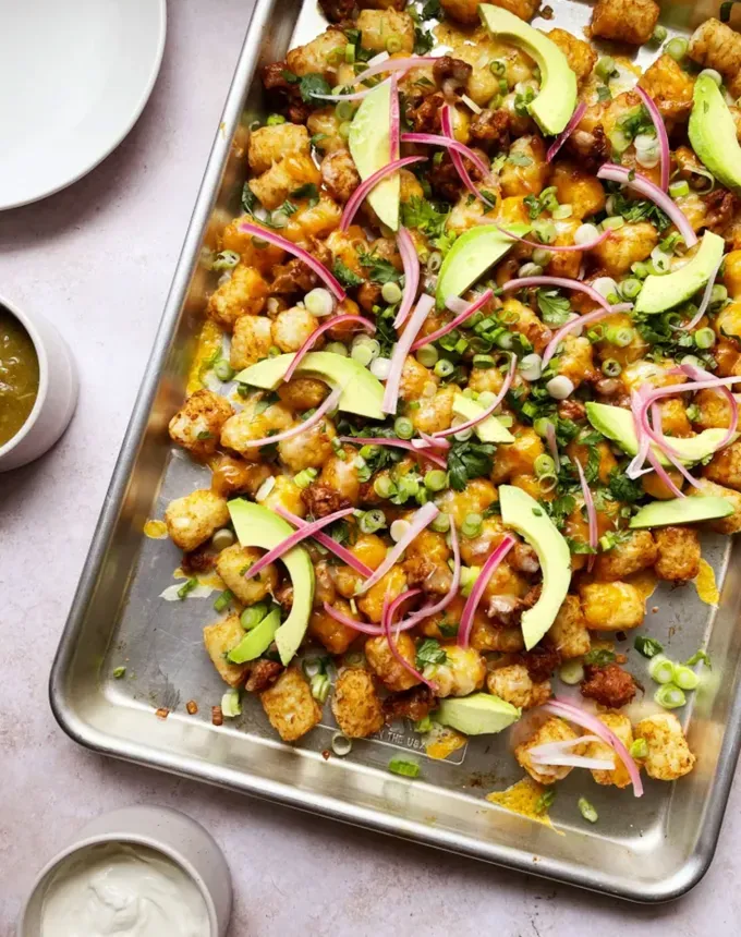 savory appetizers: tater tot nachos' title='51 Savory Appetizers That Are Sure to Get the Party Started from Make-Ahead Gems to Cheesy Delights
