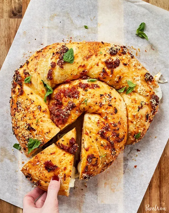 savory appetizers: mozzarella-stuffed pizza bread' title='51 Savory Appetizers That Are Sure to Get the Party Started from Make-Ahead Gems to Cheesy Delights