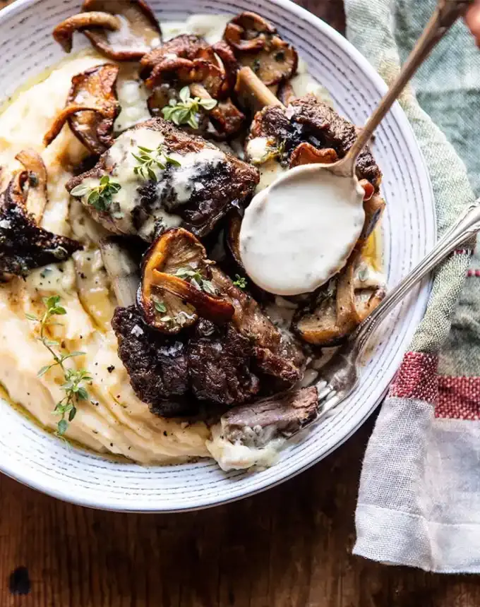 valentine’s day dinner ideas: white wine braised short ribs with buttered mushroom cream sauce' title='60 Valentine’s Day Dinner Ideas That Feel Fancy (but Not Cheesy)