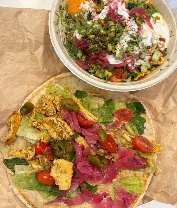 cava chicken shawarma review: cava chicken shawarma bowl and wrap side by side' fetchpriority='auto' title='CAVA Has a New Juicy Warm-Spiced Protein—Here’s a Food Editor’s Review