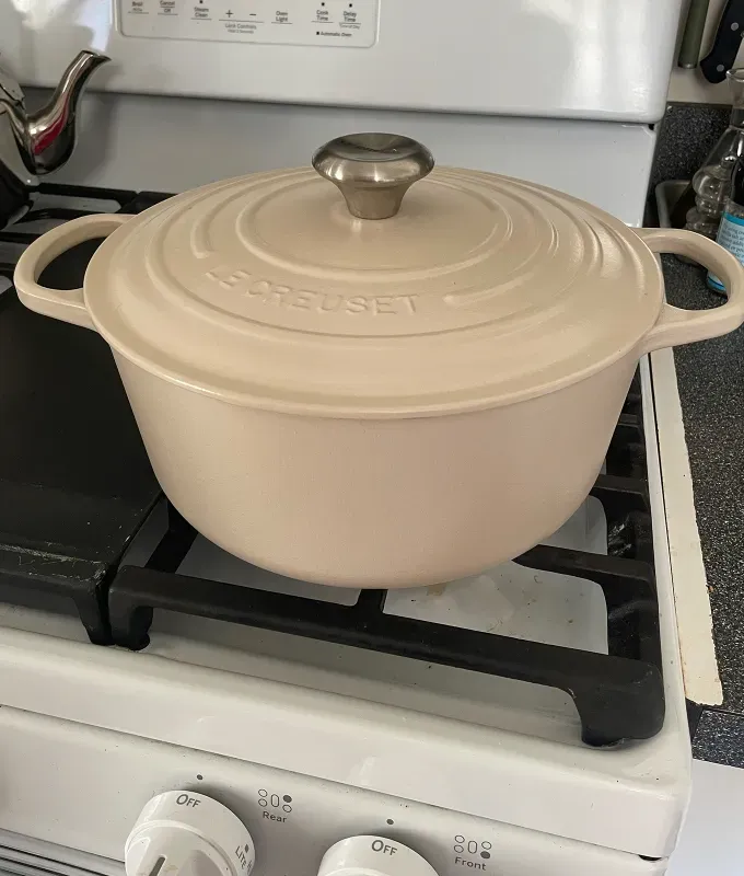 staub vs le creuset: brioche colored le creuset dutch oven' title='Staub vs. Le Creuset: Which Iconic Dutch Oven Is Right for You?