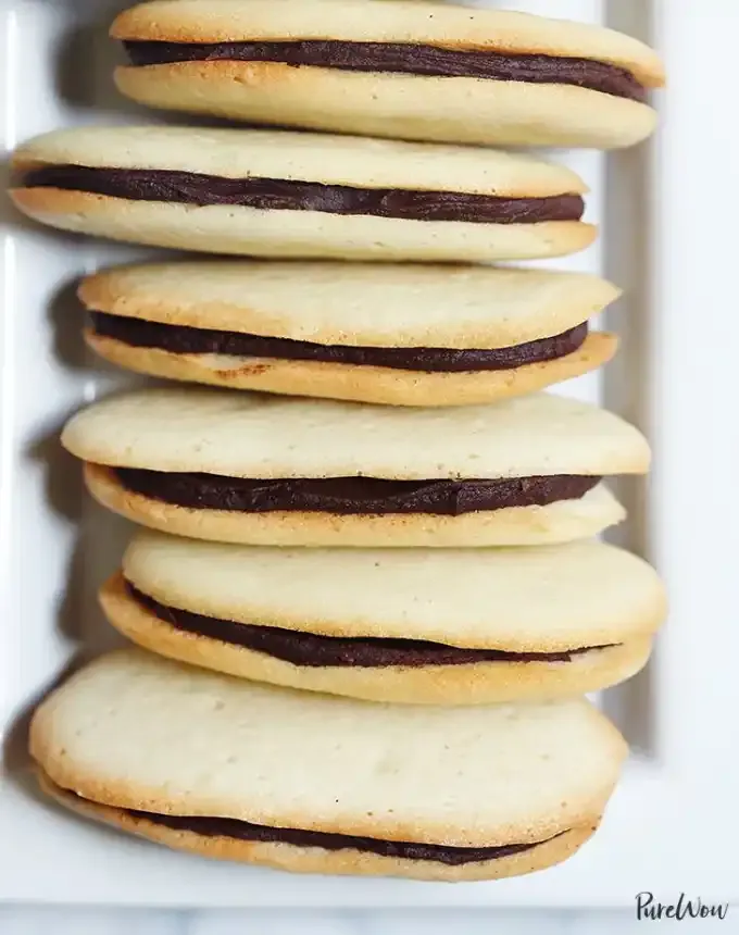 fun things to bake: aerial of six homemade milano cookies on a plate' title='78 Easy Fun Things to Bake When You’re Bored and Craving Something Sweet