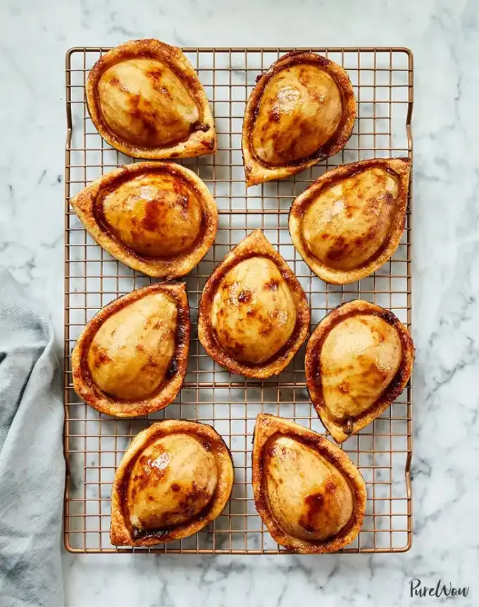 fun things to bake: nine brown sugar pear puff pastries on a cooling rack' title='78 Easy Fun Things to Bake When You’re Bored and Craving Something Sweet