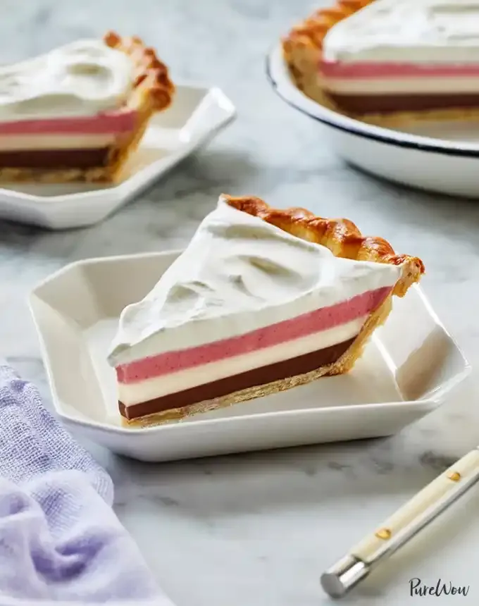 fun things to bake: three slices of neapolitan pie with strawberry vanilla and chocolate layers topped with whipped cream' title='78 Easy Fun Things to Bake When You’re Bored and Craving Something Sweet