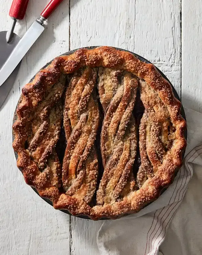 fun things to bake: aerial of cherry ginger pie topped with braided crust' title='78 Easy Fun Things to Bake When You’re Bored and Craving Something Sweet