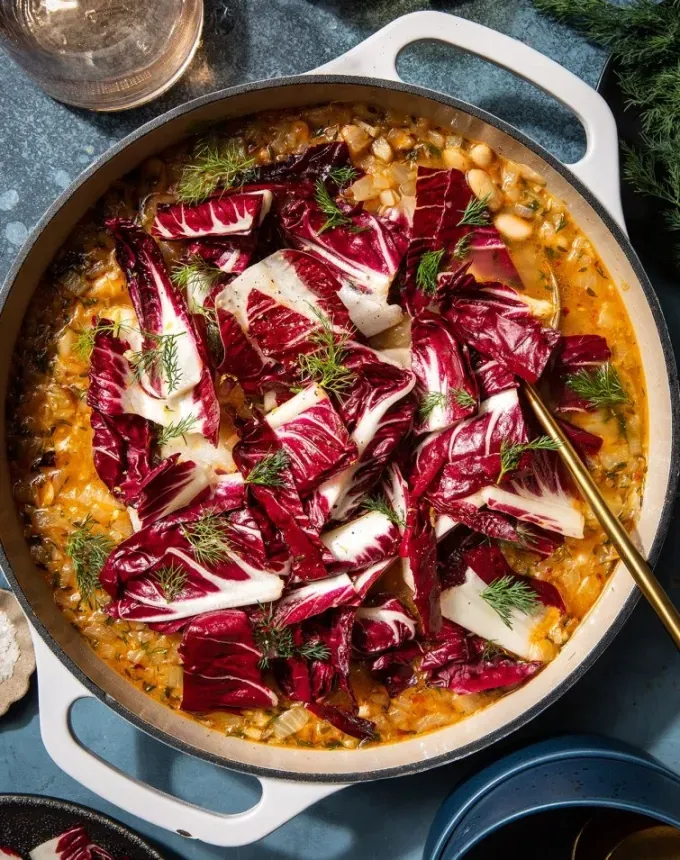 birthday dinner ideas: white bean stew with marinated radicchio in dutch oven' title='60 Home-Cooked Birthday Dinner Ideas That Will Make Anyone’s Day
