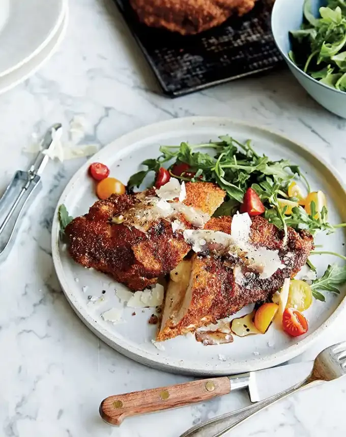 birthday dinner ideas: chrissy teigen cheesy chicken milanese' title='60 Home-Cooked Birthday Dinner Ideas That Will Make Anyone’s Day