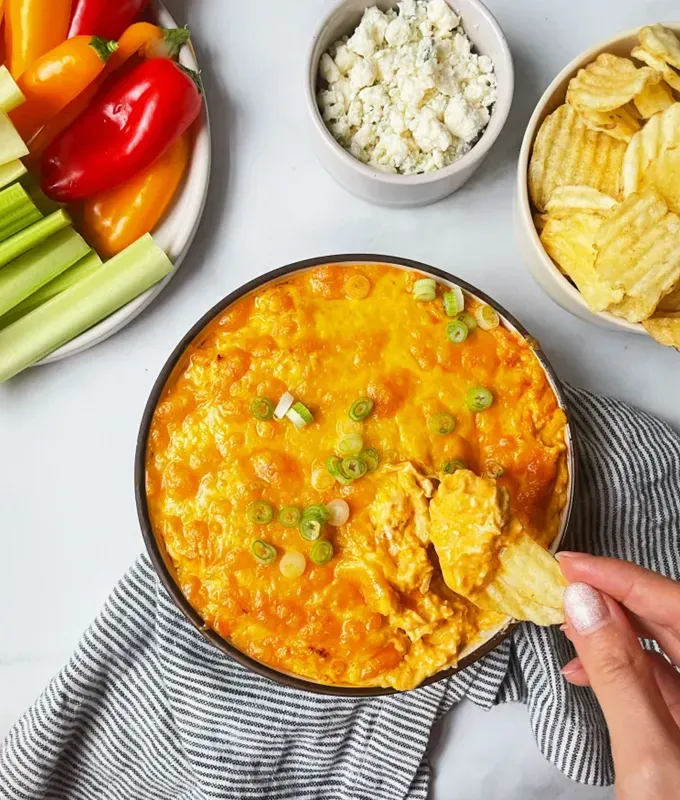 best appetizers to bring to a party: slow cooker buffalo chicken dip' title='The 25 Best Appetizers to Bring to a Party from Crowd-Pleasing Dips to Make-Ahead Snacks
