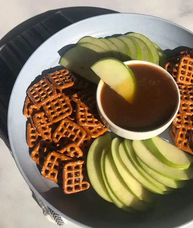 best appetizers to bring to a party: vegan miso caramel with pretzels and apples' title='The 25 Best Appetizers to Bring to a Party from Crowd-Pleasing Dips to Make-Ahead Snacks