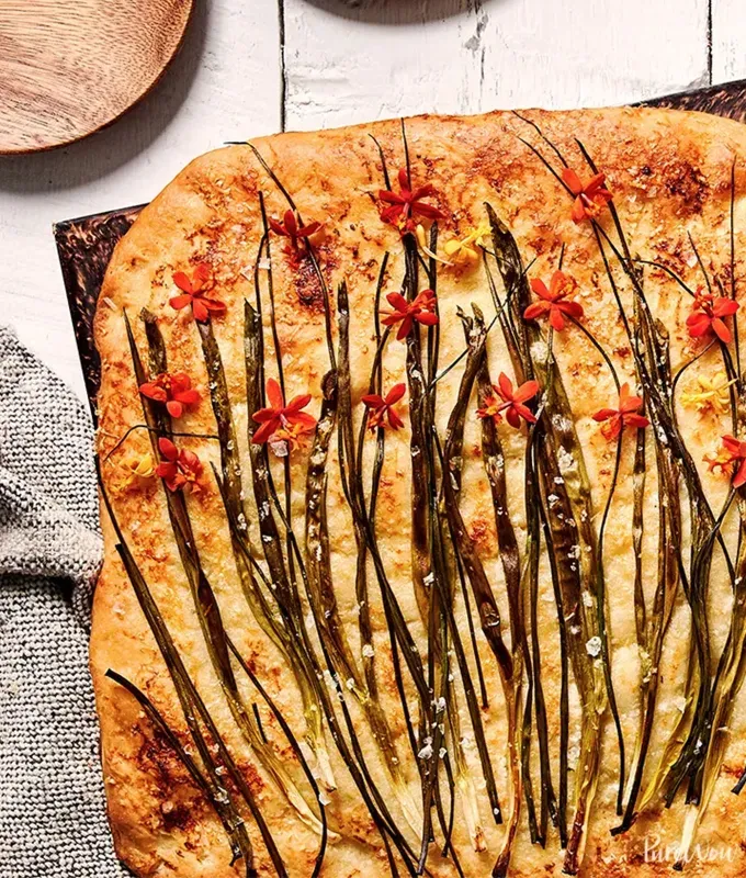 best appetizers to bring to a party: scallion chive flatbread' title='The 25 Best Appetizers to Bring to a Party from Crowd-Pleasing Dips to Make-Ahead Snacks