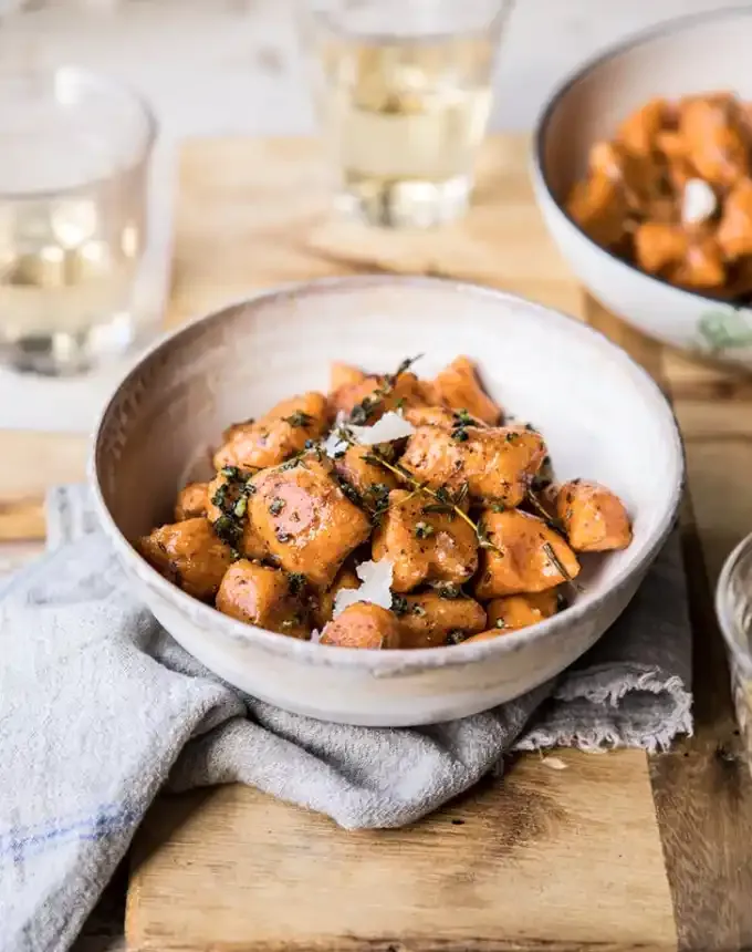 easy gnocchi recipes: sweet potato gnocchi in herbed white wine sauce' title='35 Easy Gnocchi Recipes You Can Make at Home
