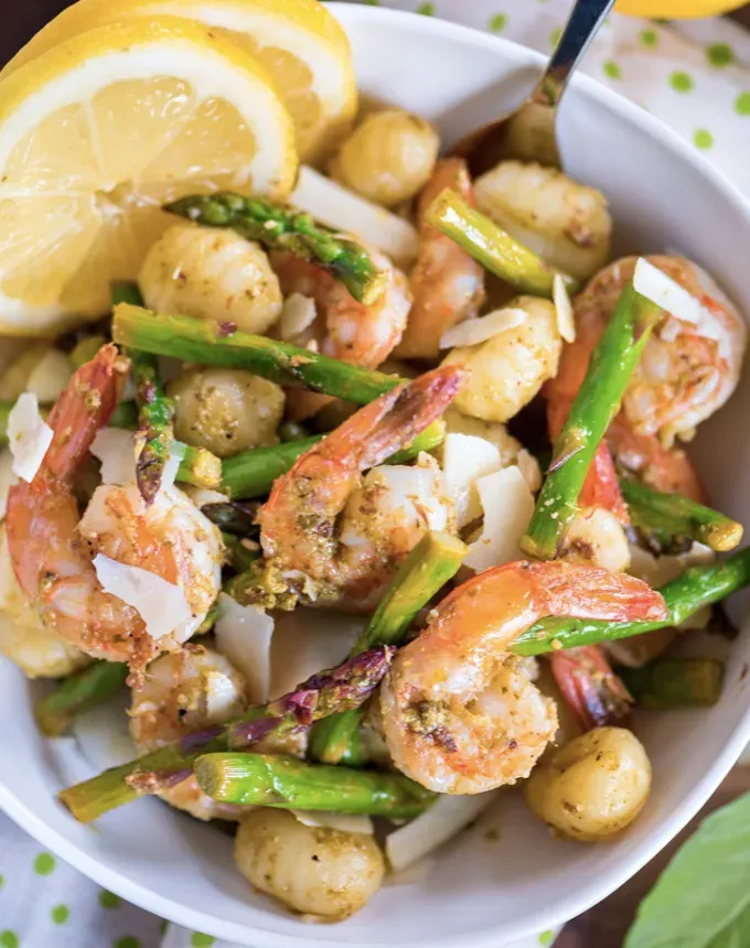 easy gnocchi recipes: 20-minute pesto shrimp with gnocchi and asparagus' title='35 Easy Gnocchi Recipes You Can Make at Home