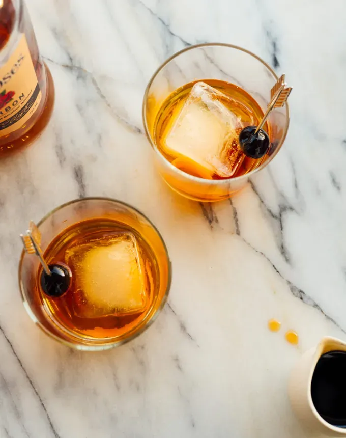 low sugar cocktails: an overhead shot of two maple old fashioned cocktails' title='20 Delicious Low-Sugar Cocktails That Aren’t Syrupy-Sweet