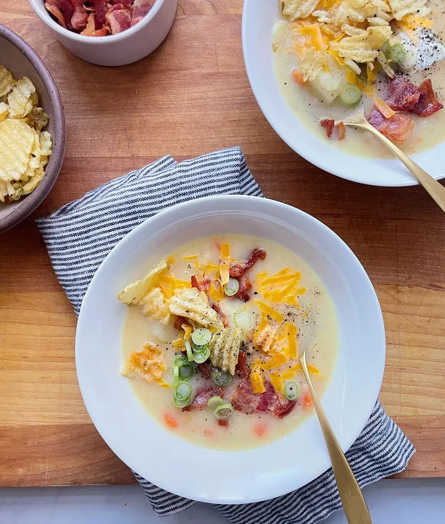 side dishes for ham: bowl of instant pot baked potato soup topped with scallions and bacon' title='62 Side Dishes for Ham to Serve on Easter Christmas and Every Day in Between