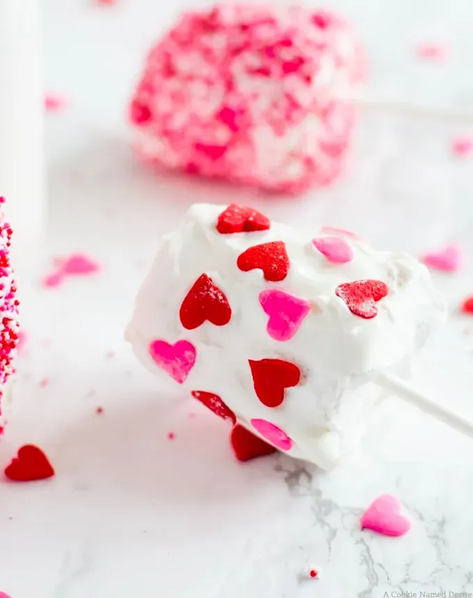 valentines day snacks: a marshmallow decorated with pink and red heart sprinkles.' title='31 Valentine’s Day Snacks That Make Sweet Lunchbox Treats
