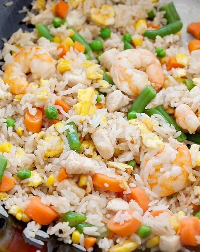 traditional chinese foods: shrimp fried rice with vegetables' title='20 Traditional Chinese Food Dishes You Need to Try According to a Chinese-Malaysian Chef