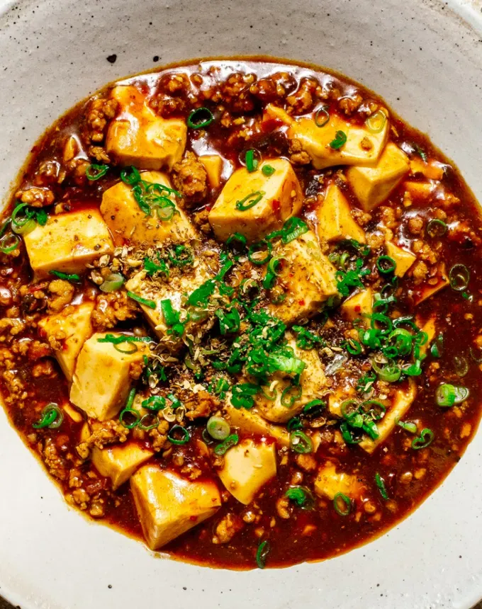 traditional chinese foods: aerial of mapo tofu in a bowl' title='20 Traditional Chinese Food Dishes You Need to Try According to a Chinese-Malaysian Chef