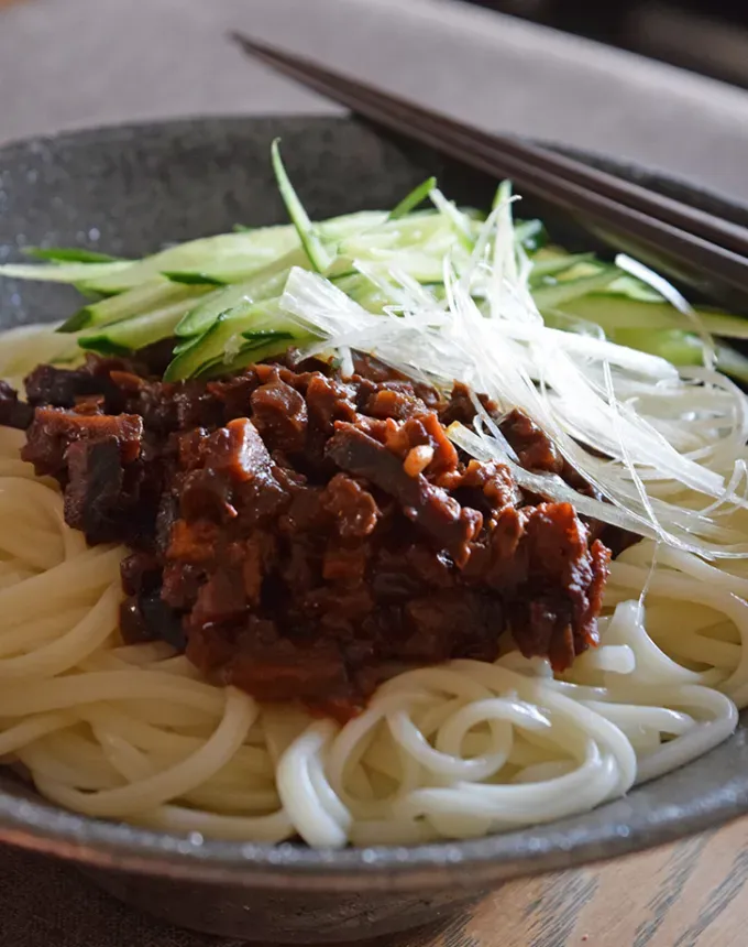 traditional chinese foods: zhajiangmian noodles in a bowl' title='20 Traditional Chinese Food Dishes You Need to Try According to a Chinese-Malaysian Chef