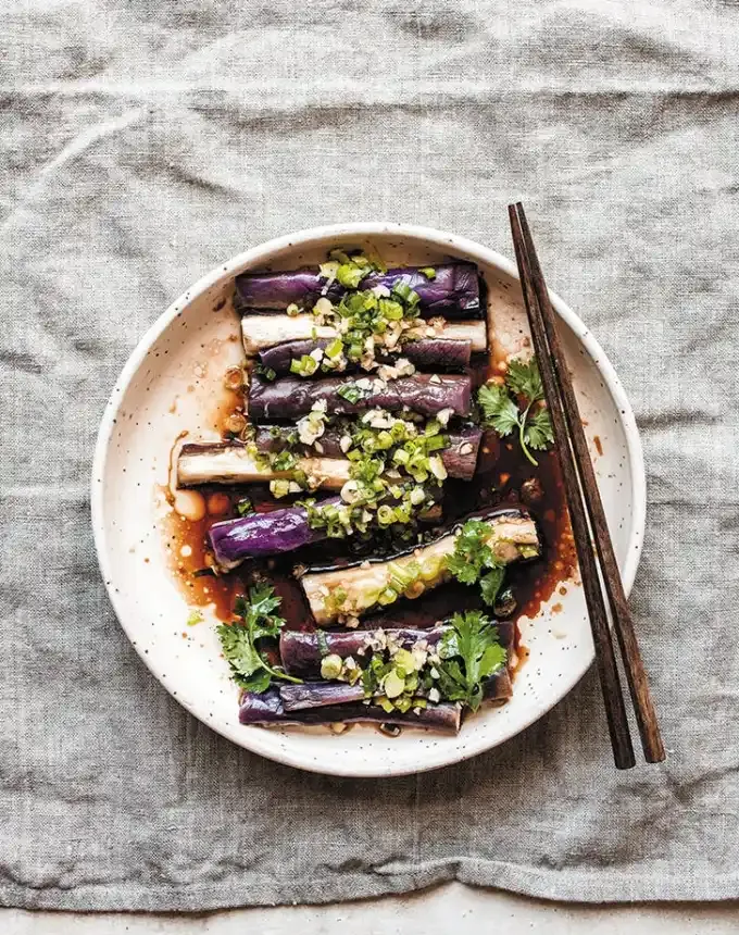 traditional chinese foods: chinese seasoned steamed egg plant on a plate with chopsticks' title='20 Traditional Chinese Food Dishes You Need to Try According to a Chinese-Malaysian Chef