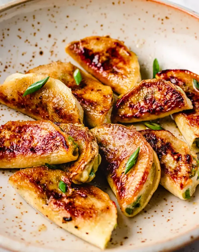 traditional chinese foods: jiaozi chinese dumplings in a bowl' title='20 Traditional Chinese Food Dishes You Need to Try According to a Chinese-Malaysian Chef