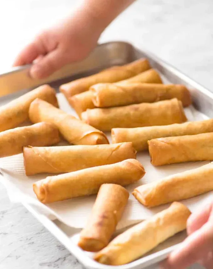 traditional chinese foods: sheet tray of chinese-style spring rolls' title='20 Traditional Chinese Food Dishes You Need to Try According to a Chinese-Malaysian Chef