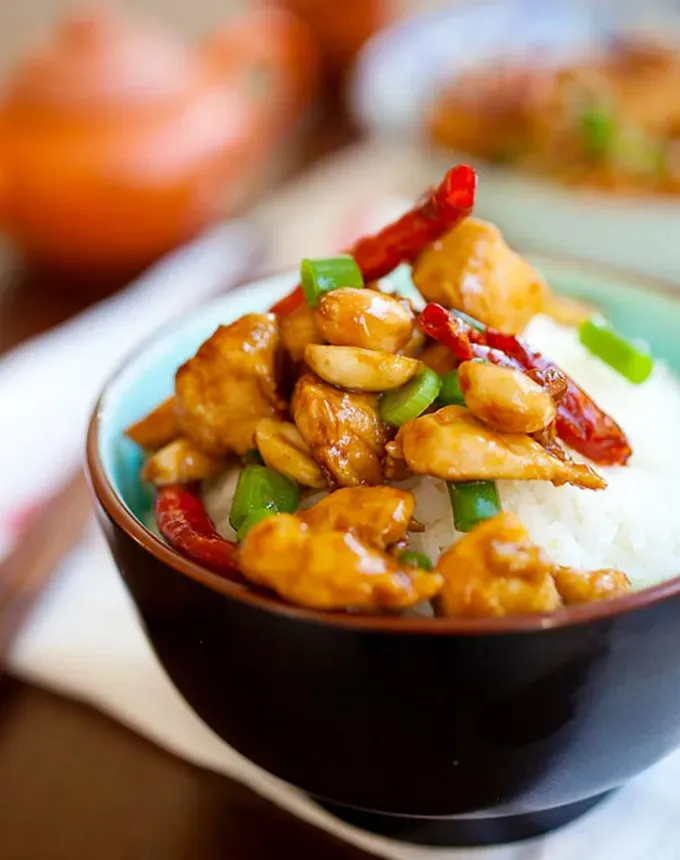 traditional chinese foods: bowl of kung pao chicken on rice' title='20 Traditional Chinese Food Dishes You Need to Try According to a Chinese-Malaysian Chef