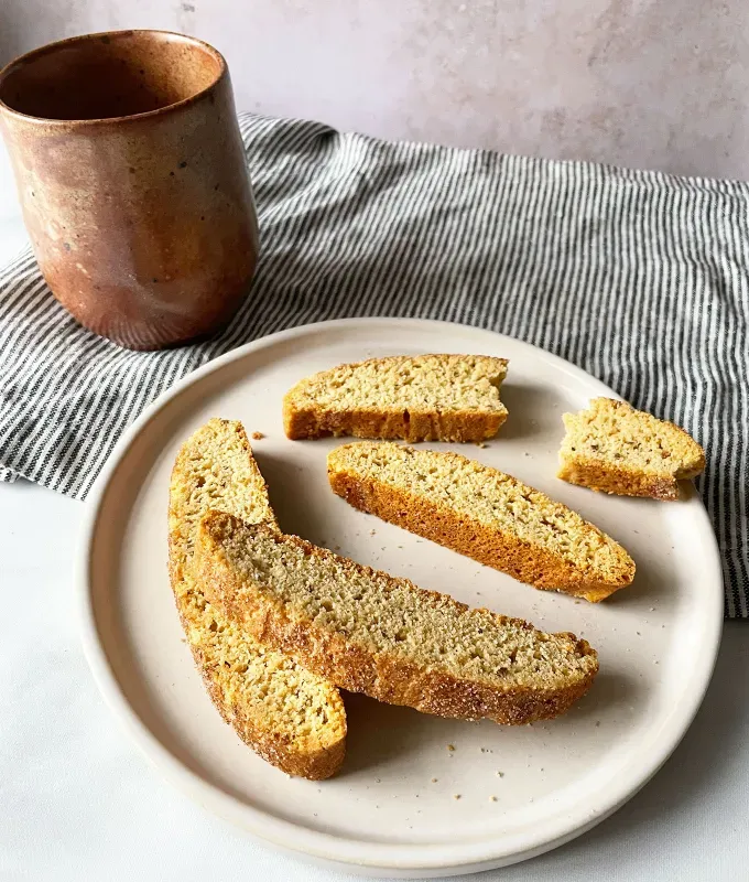 types of cookies_biscochito biscotti on a plate with a mug of coffee' title='The 23 Types of Cookies Every Baker Should Master