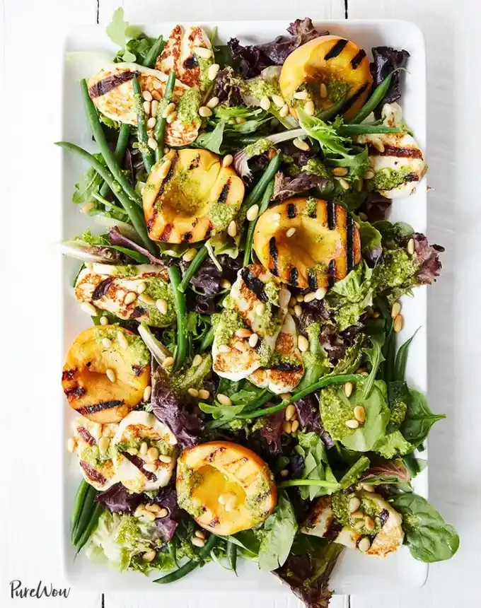 bbq menu ideas: grilled peach and halloumi salad with lemon pesto dressing' title='36 BBQ Menu Ideas: Recipes That Will Transform Your Backyard Party
