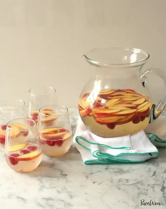 bbq menu ideas: white sangria with peaches and berries' title='36 BBQ Menu Ideas: Recipes That Will Transform Your Backyard Party