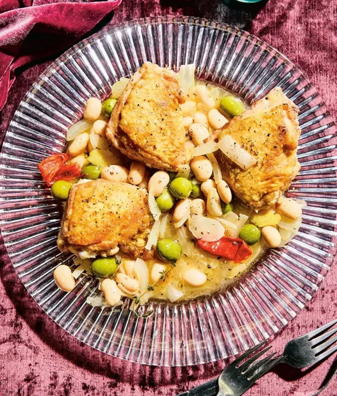 chicken meal prep recipes: crispy chicken thighs over vinegar beans' title='40 Chicken Meal Prep Recipes That Never Get Boring