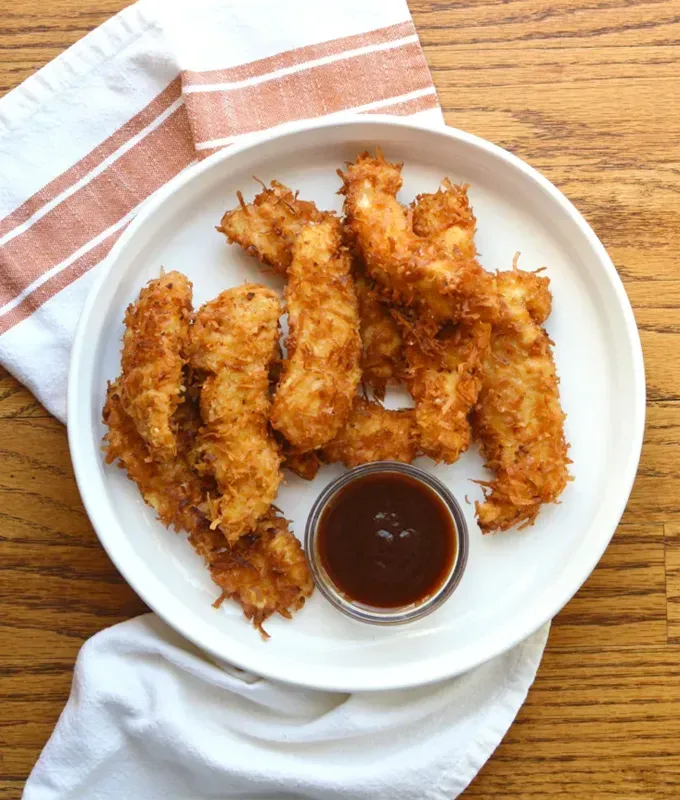 chicken meal prep recipes: coconut chicken tenders' title='40 Chicken Meal Prep Recipes That Never Get Boring