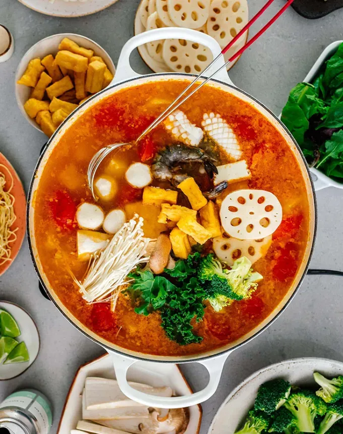 easy dinner party recipes: aerial of chinese hot pot' title='34 Easy Dinner Party Recipes for Stress-Free Entertaining