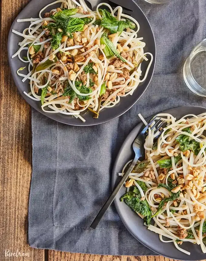 easy lunch ideas: two plates of 15-minutes cheater’s pad thai' title='82 Easy Lunch Ideas That Are Fast Low-Fuss and Foolproof