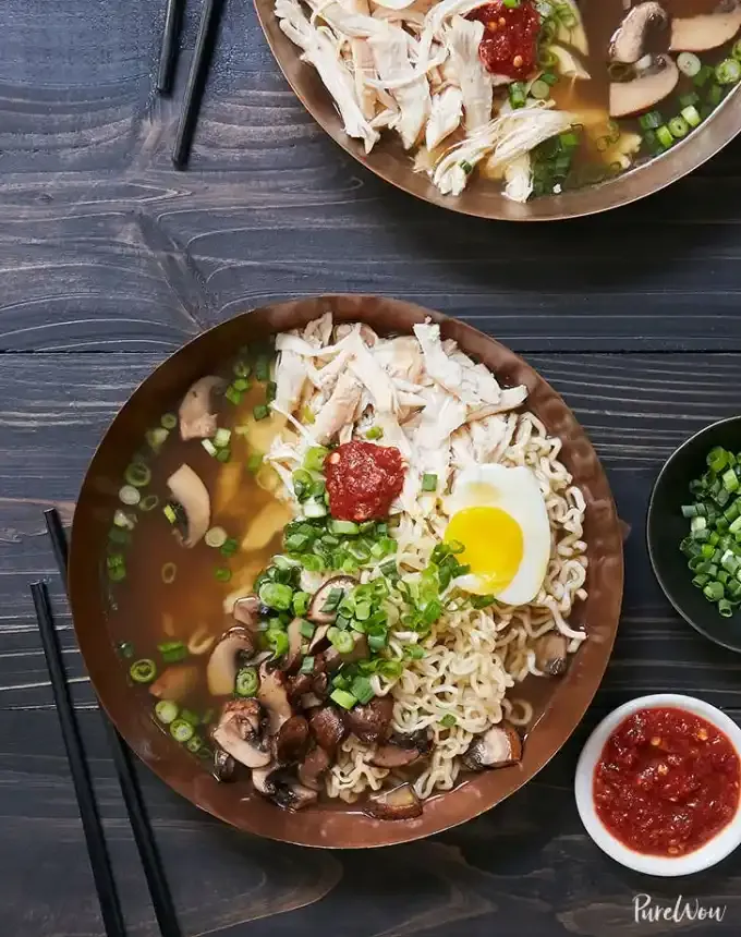 easy lunch ideas: two bowls of rotisserie chicken ramen topped with soft-boiled egg and chili sauce' title='82 Easy Lunch Ideas That Are Fast Low-Fuss and Foolproof