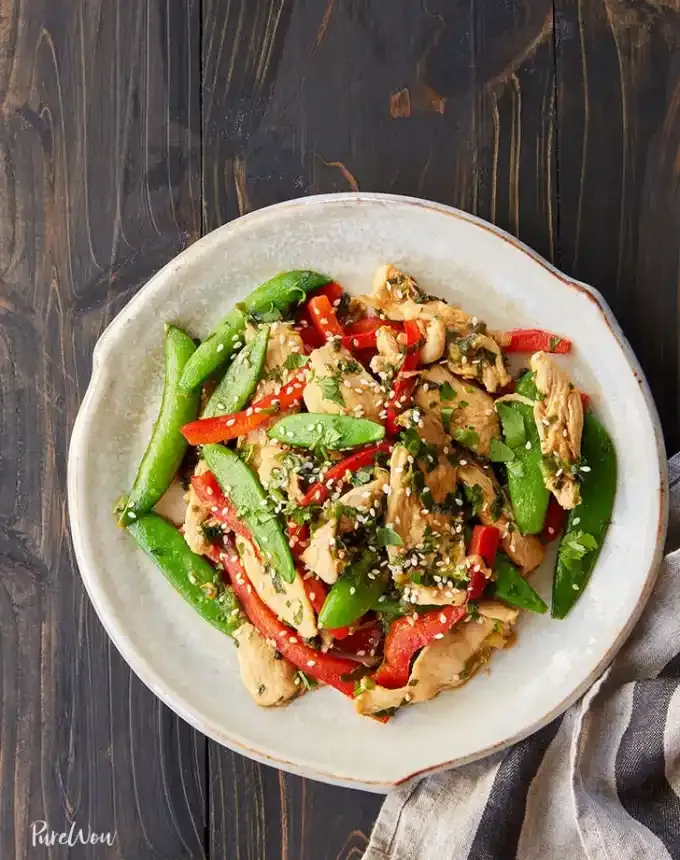 easy lunch ideas: snap pea and chicken stir fry on a plate' title='82 Easy Lunch Ideas That Are Fast Low-Fuss and Foolproof