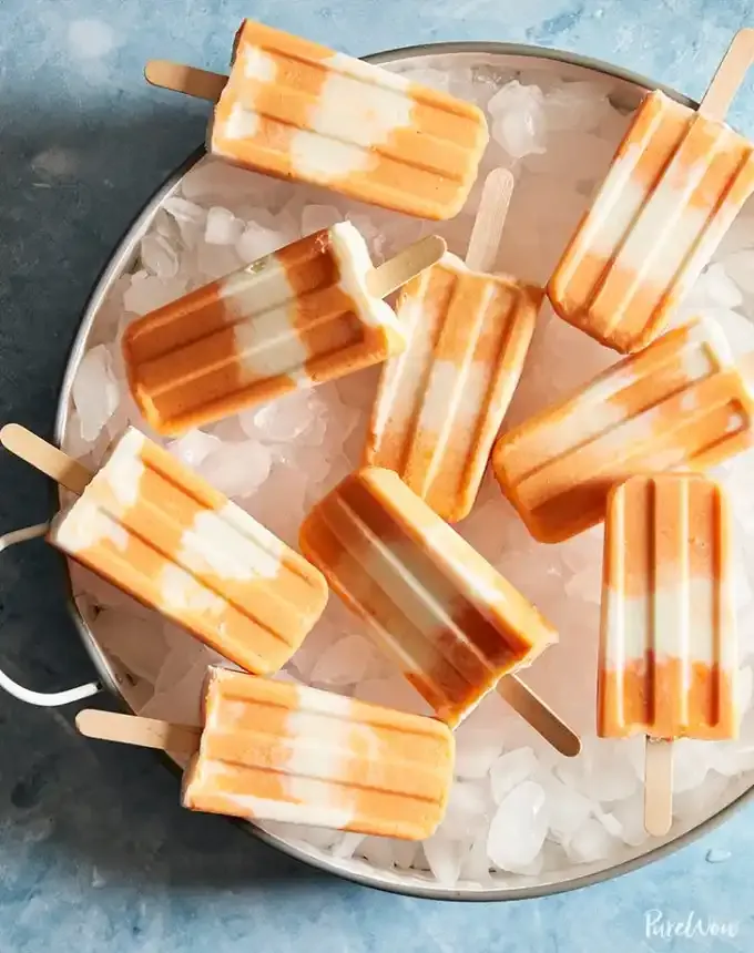 easy summer dessert recipes: peaches and cream ice pops' title='92 Easy Summer Desserts to Devour from Now Until Labor Day
