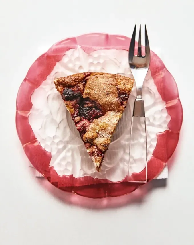 easy summer dessert recipes: slice of alison roman’s raspberry ricotta cake on a plate with a fork' title='92 Easy Summer Desserts to Devour from Now Until Labor Day