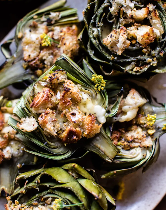brie recipes: brie-stuffed artichokes on a platter' title='The 43 Most Delicious Brie Recipes That Put the Cheese Front and Center