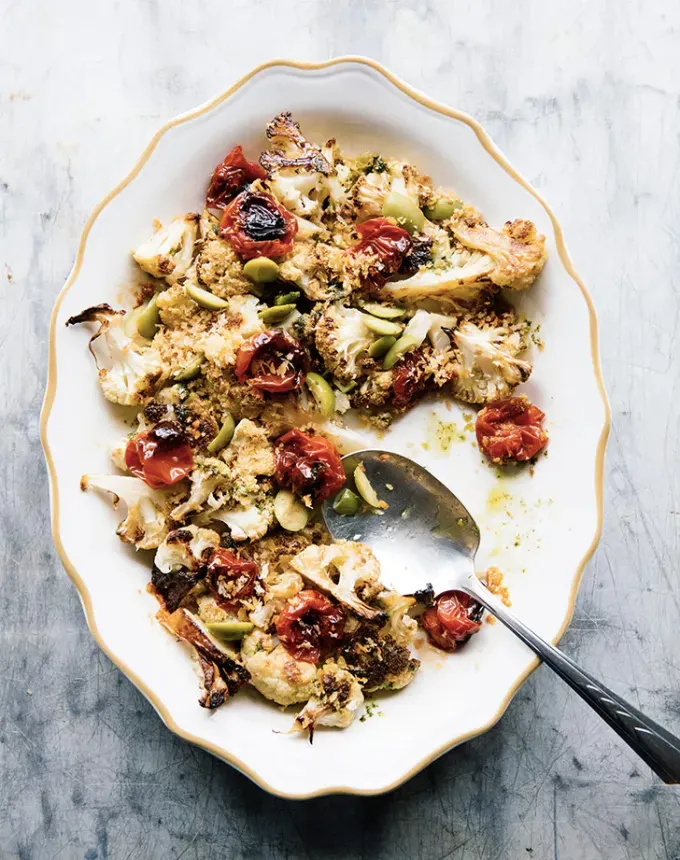 what to serve with lamb: cauliflower with roasted tomatoes' title='The 46 Best Side Dishes for Lamb to Serve at Dinner Parties Barbecues and Beyond