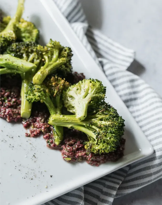 what to serve with lamb: roasted broccoli with olive tapenade' title='The 46 Best Side Dishes for Lamb to Serve at Dinner Parties Barbecues and Beyond